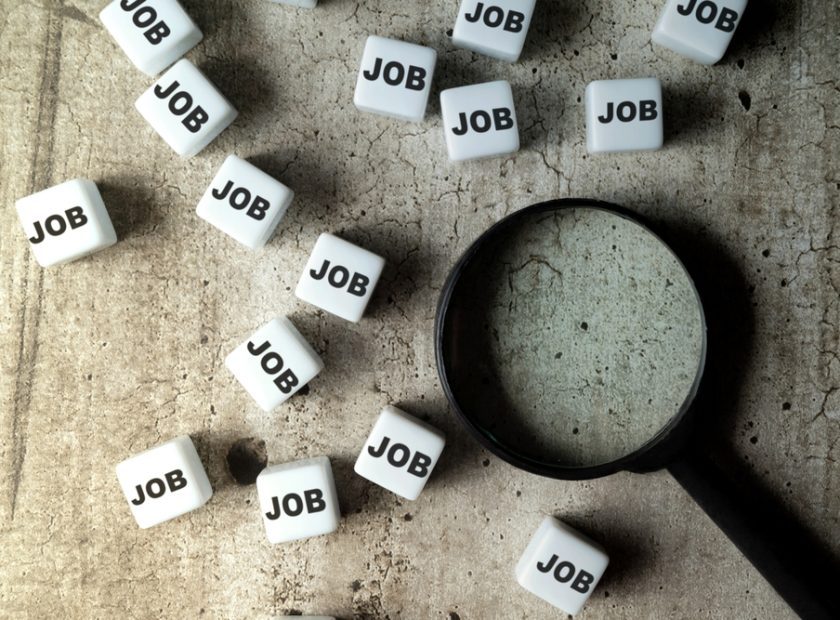 Magnifying,Glass,And,A,Bunch,Of,Small,Cubes,With,Jobs